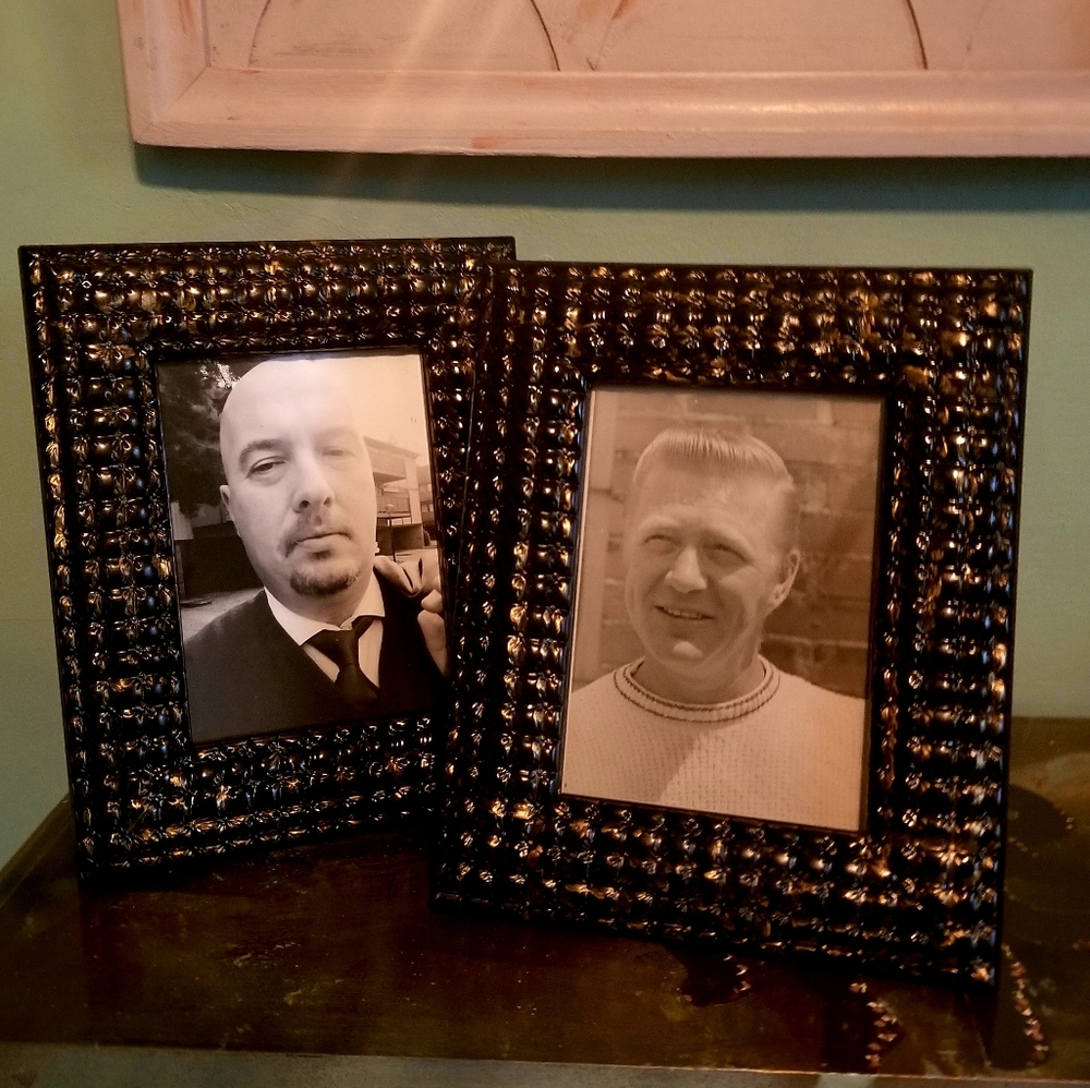 Pair of Enchante' picture frames. Color is dark blue with gold accent.